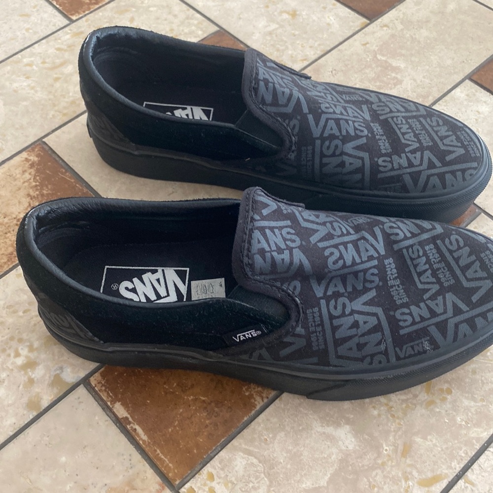 Vans Slip-On shoes size7.5 Black with signature Vans all over them.